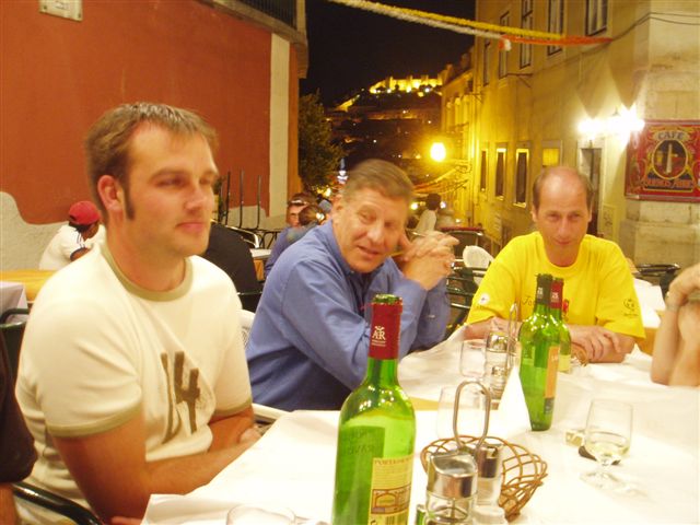 Elbows on the tables to stop the tablecloths blowing away. 