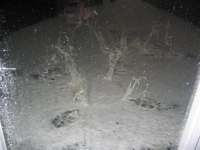 water is forced back up & lifts the drain covers