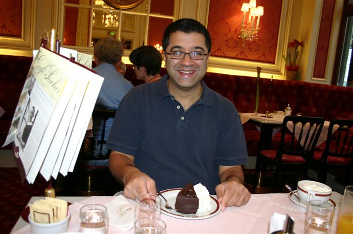 Sanjiv with his torte in Caf&eacute; Sacher